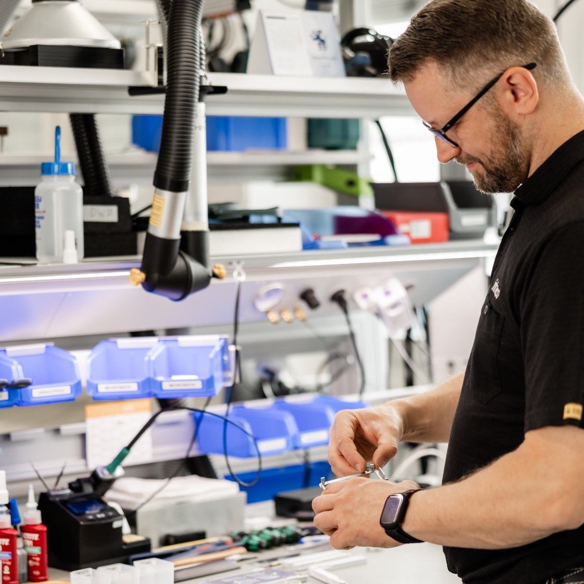 Inheco employee assembling laboratory automation equipment